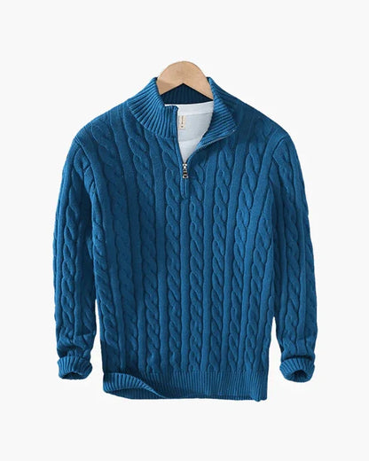 Blue cable knit quarter-zip sweater on hanger, cozy textured men's knitwear