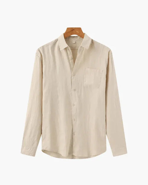 Beige long sleeve button-up shirt with chest pocket on wooden hanger
