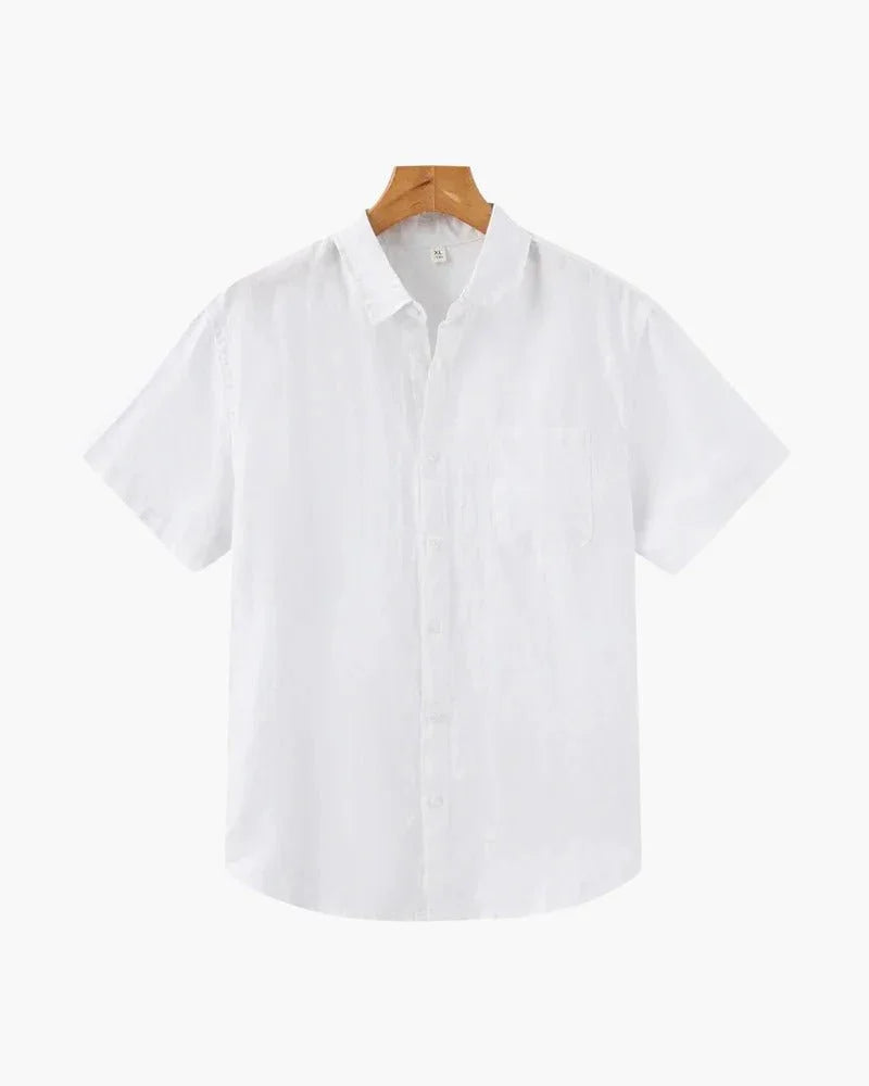 White linen short sleeve button-up shirt on wooden hanger, plain background