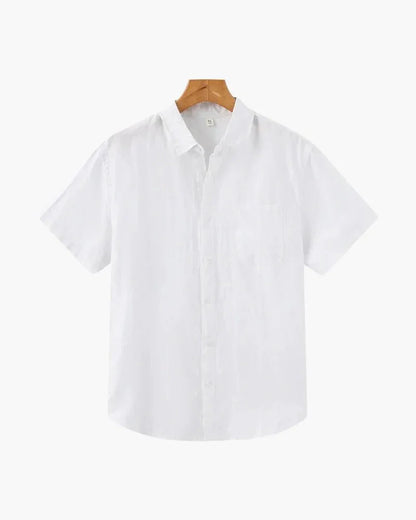 White linen short sleeve button-up shirt on wooden hanger, plain background